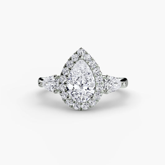 Bague trois pierres avec halo